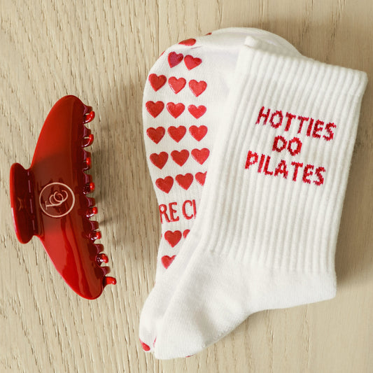 The Core Club TCC Hotties do Pilates grippy socks with red heart grips, red hair clip, pilates outfit