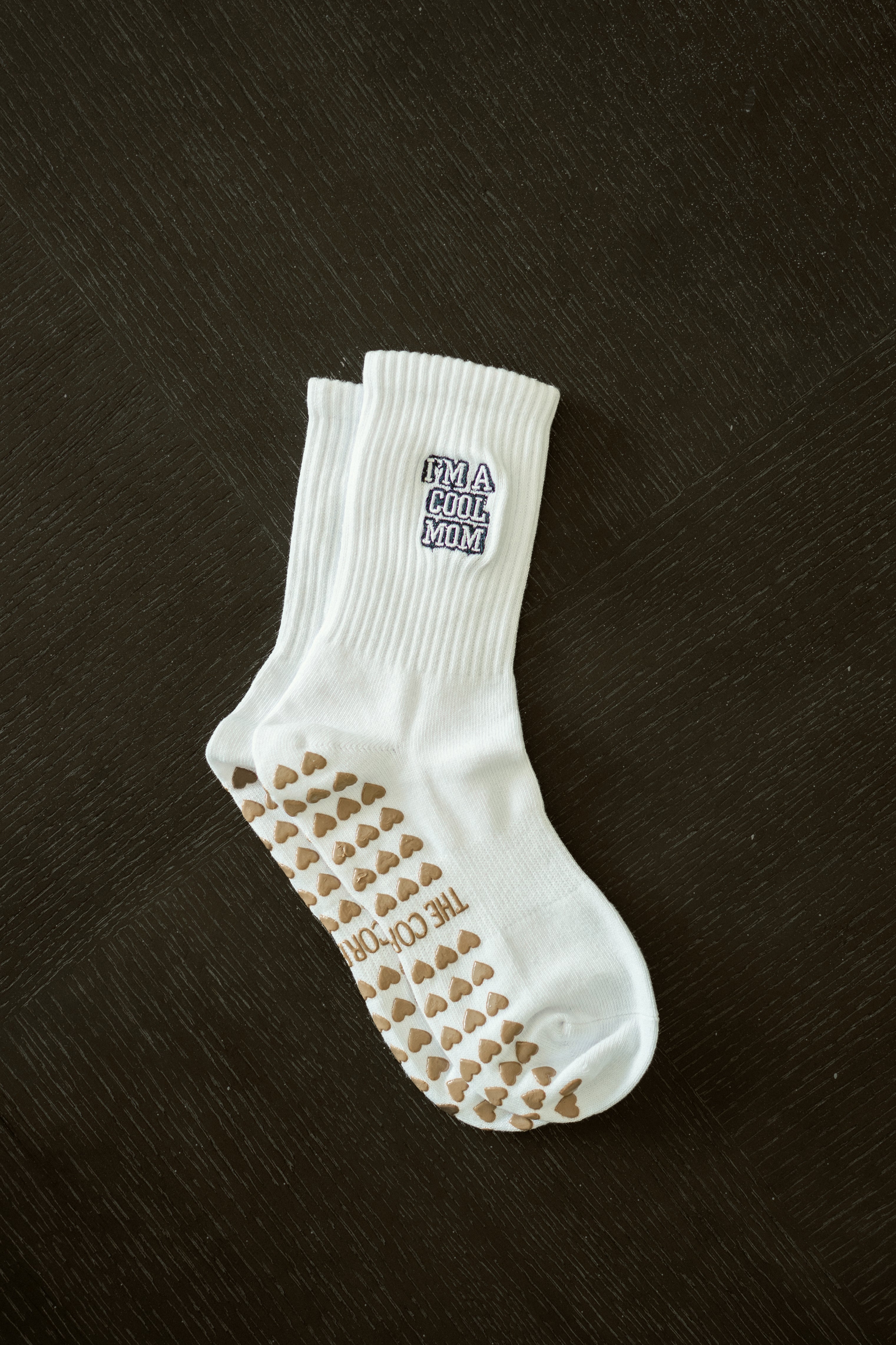 Not A Regular Mom, I’m a Cool Mom Grip Pilates Sock – soft cotton non-slip socks with black embroidery & tan heart grippies. Perfect for Pilates & yoga.