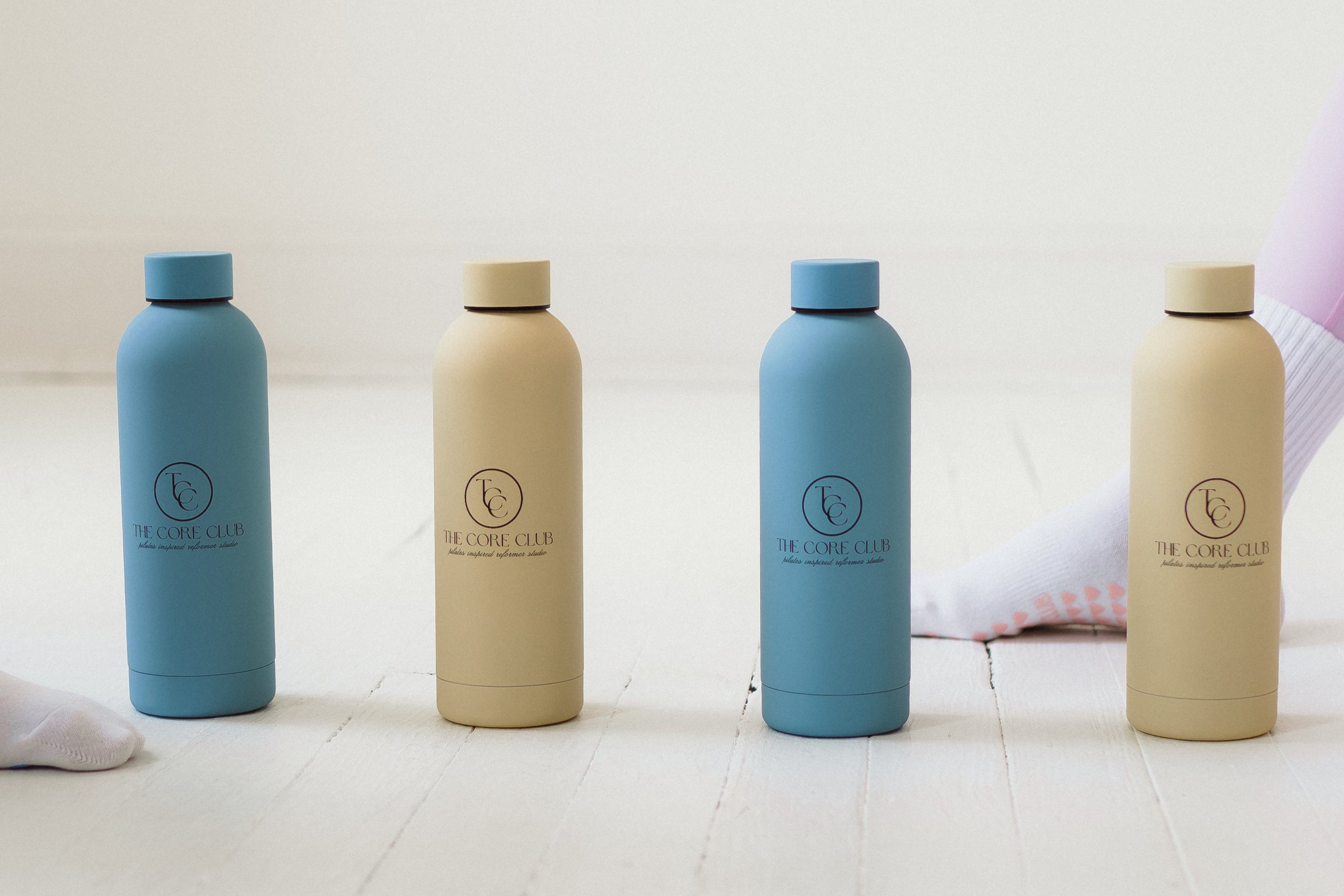 TCC Core Club pilates blue and butter yellow metal water bottles