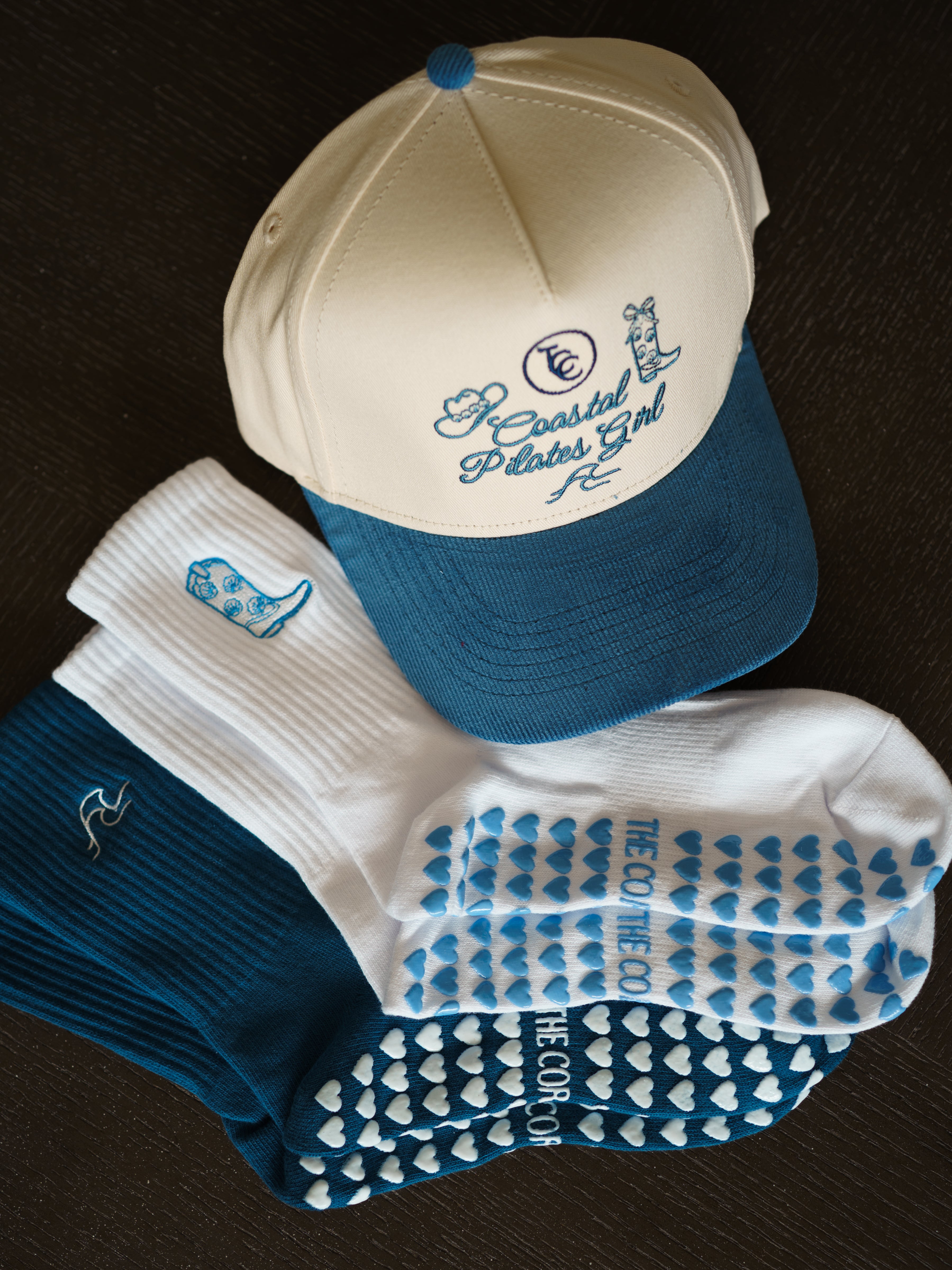 Pilates grip socks, coastal pilates girl hat, core club pilates merchandise, TCC coastal cowgirl sets and accessories